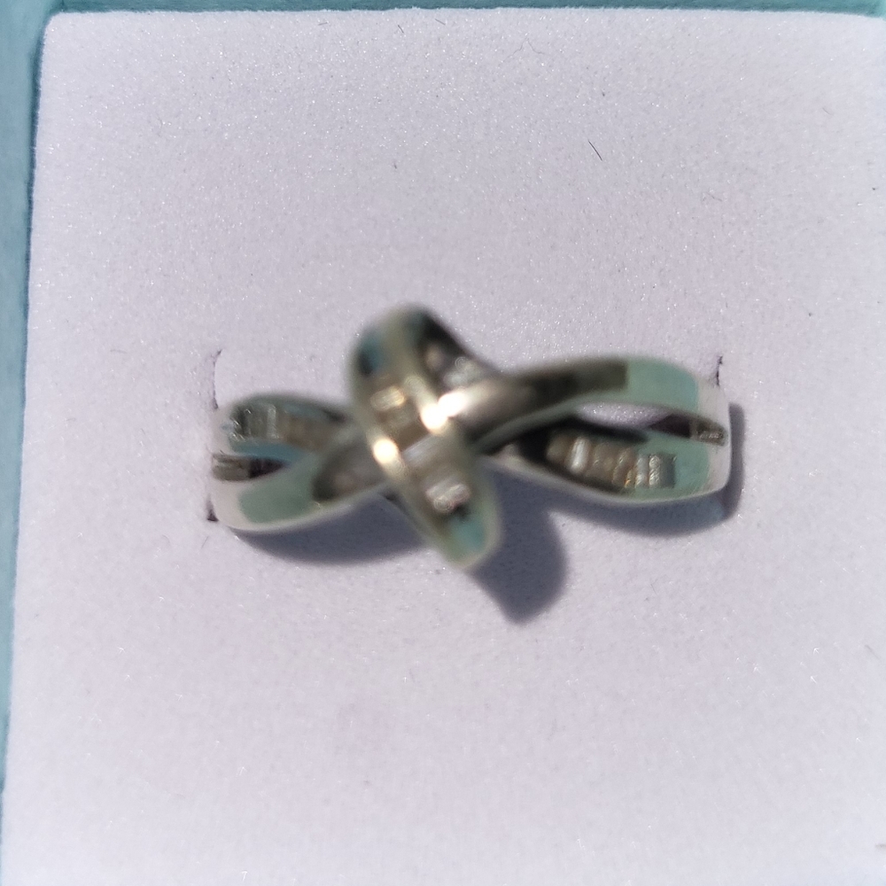 Diamond and sterling silver  size 7 knott ring